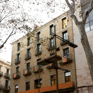 The flag of Catalunya, seen from Las Ramblas.